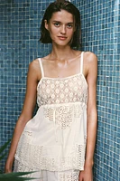 Top made of 100% viscose. Straight neckline and spaghetti straps. Matching lace appliqué adjustable drawstring at chest.