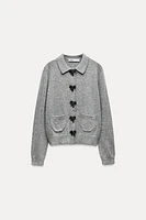 BOW-SHAPED BUTTON KNIT CARDIGAN