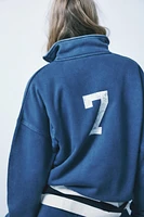 WASHED EFFECT VARSITY POLO SWEATSHIRT