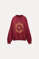 WASHED EFFECT VARSITY SWEATSHIRT