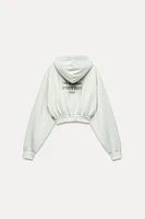 WASHED EFFECT HOODED CROP TEXT SWEATSHIRT