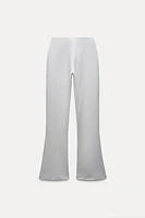 BELTED FLARED INTERLOCK PANTS