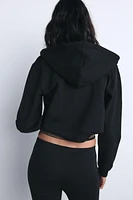 CROPPED INTERLOCK SWEATSHIRT