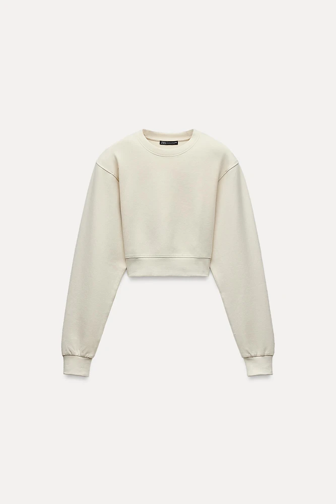 CROPPED INTERLOCK SWEATSHIRT