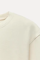 CROPPED INTERLOCK SWEATSHIRT