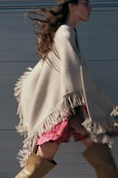 FRINGED KNIT CAPE