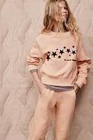 FLOCKED TEXT STAR SWEATSHIRT