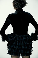 Mini skirt with a mid elastic waistband. Tulle ruffle details. Matching interior lining.<br/><br/>Halloween special collection.