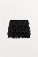 Mini skirt with a mid elastic waistband. Tulle ruffle details. Matching interior lining.<br/><br/>Halloween special collection.