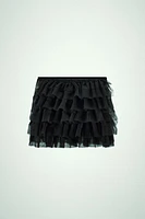 Mini skirt with a mid elastic waistband. Tulle ruffle details. Matching interior lining.<br/><br/>Halloween special collection.