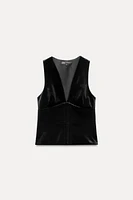 Sleeveless V-neck top. Interior lining. Front metal hook closure.