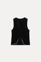 Sleeveless V-neck top. Interior lining. Front metal hook closure.