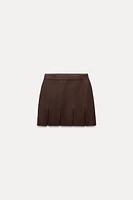 BOX PLEAT KNIT MINI SKIRT