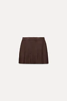 BOX PLEAT KNIT MINI SKIRT