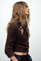 FAUX FUR KNIT SWEATER WITH BROOCHES