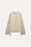 FRINGED KNIT SWEATER