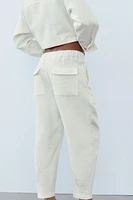 RUSTIC PANTS WITH PLEATED HEMS