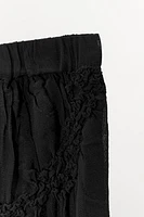 ASYMMETRIC SKIRT WITH TEXTURED RUCHING