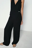 ASYMMETRIC VEST JUMPSUIT