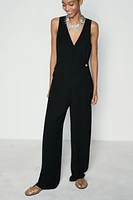 ASYMMETRIC VEST JUMPSUIT