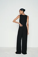 ASYMMETRIC VEST JUMPSUIT