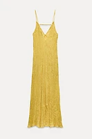 ZARA WOMAN COLLECTION<br/><br/>Long dress made of 100% linen. V-neck with spaghetti straps. Front pockets. Wrinkled fabric.