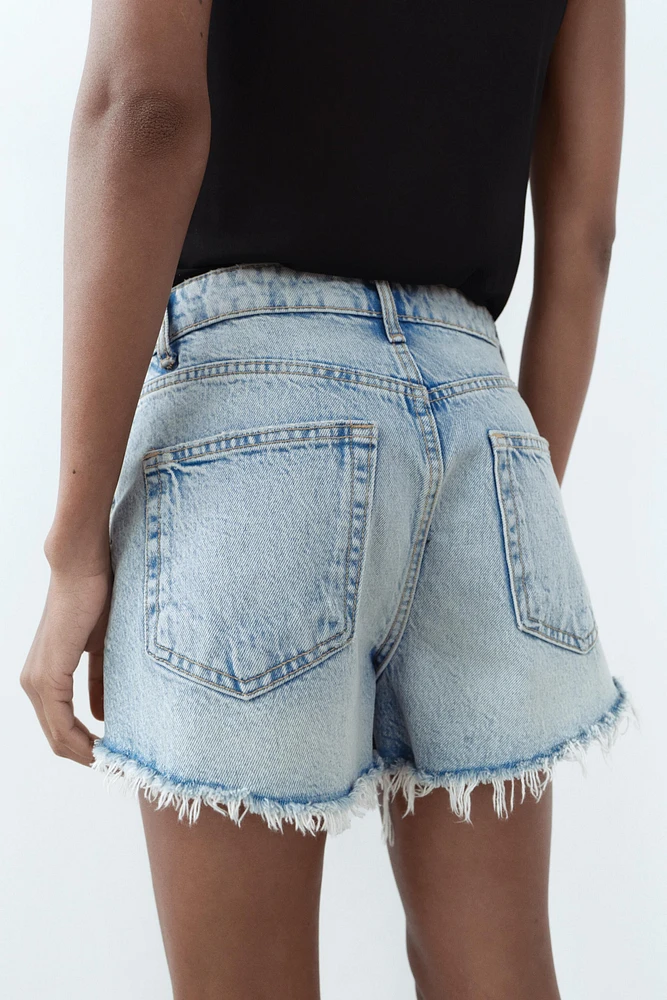 TRF HIGH WAIST RIPPED CURVED DENIM SHORTS