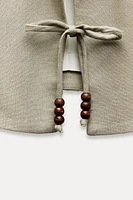 LINEN BLEND VEST WITH BEADED BOWS