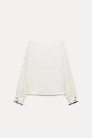 PLEATED RUFFLE BLOUSE