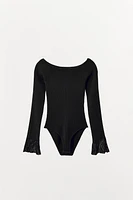 RUFFLED RIB BODYSUIT