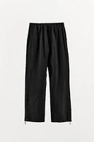 WIDE LEG ZIPPER PANTS