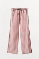 STRIPED PANTS WITH CONTRASTING PIPING