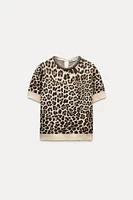 JACQUARD KNIT ANIMAL PRINT JEWELED NECKLINE TOP