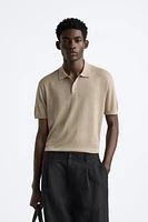 Cotton and silk blend polo shirt. Lapel collar with front button closure short sleeves. Rib trim.