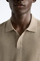 Cotton and silk blend polo shirt. Lapel collar with front button closure short sleeves. Rib trim.