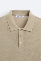 Cotton and silk blend polo shirt. Lapel collar with front button closure short sleeves. Rib trim.