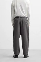 PLEATED CHINO PANTS