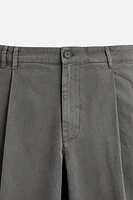 PLEATED CHINO PANTS