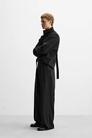 Wide fit pants. Front pleats at waist. Side pockets and back welt pockets. zip hidden metal hook closure.