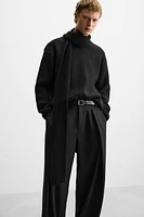 Wide fit pants. Front pleats at waist. Side pockets and back welt pockets. zip hidden metal hook closure.