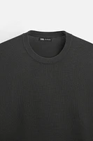 Wide cut sweater made of viscose blend fabric. Round neck and long sleeves. Rib trim.