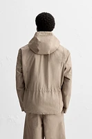 WATER REPELLENT TECHNICAL JACKET WITH POUCH POCKET