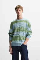 CABLE KNIT SPRAY PRINT SWEATER