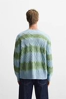 CABLE KNIT SPRAY PRINT SWEATER