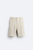 TEXTURED WEAVE RUFFLED SHORTS