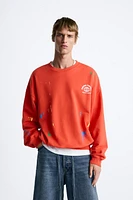 SPLATTER EFFECT TEXT SWEATSHIRT