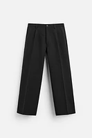 FLARED FIT PLEATED PANTS