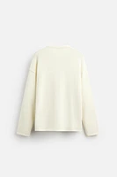 SWEATER WITH RAISED HEM