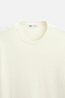 SWEATER WITH RAISED HEM