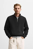 QUARTER ZIP SWEATER